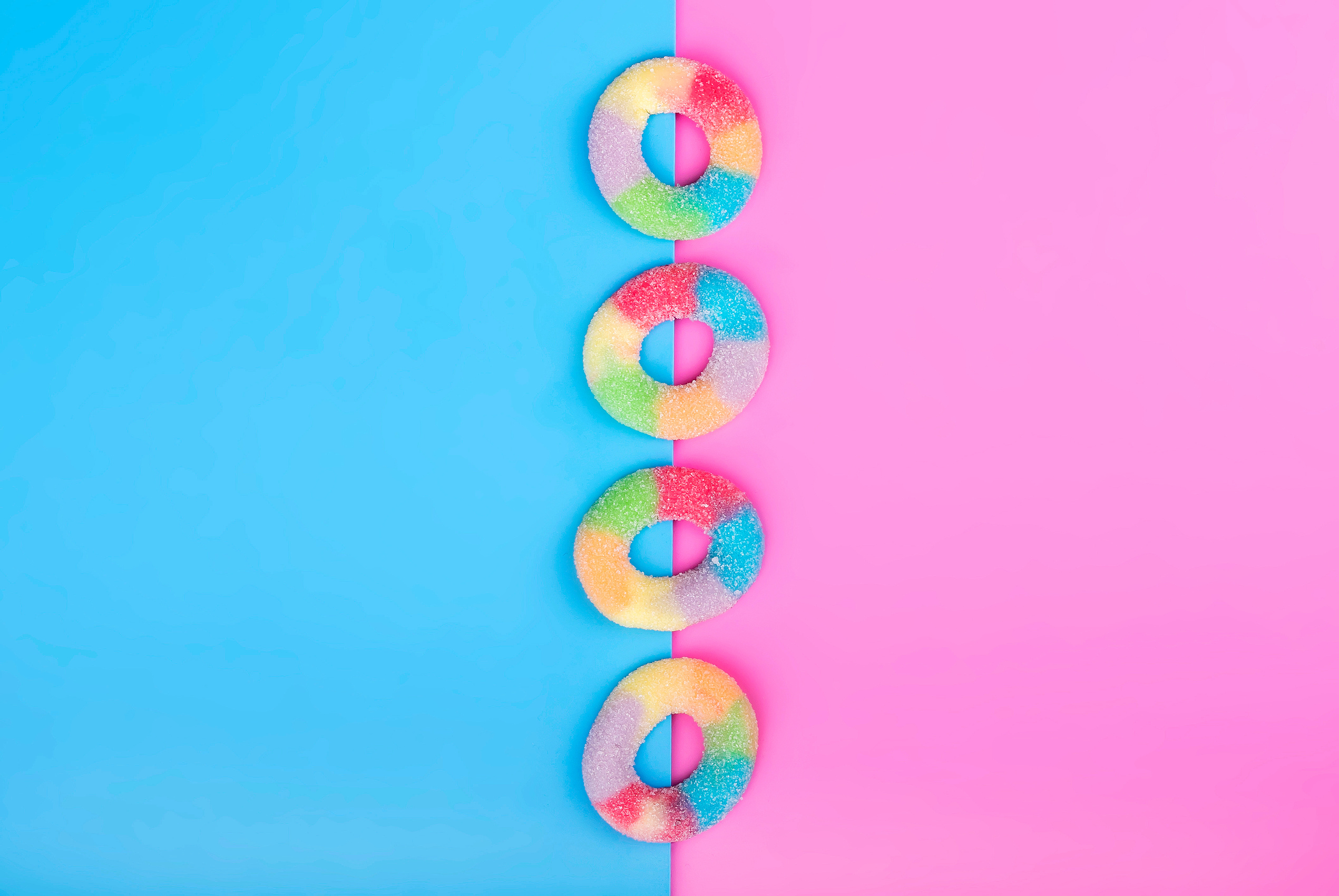 Jelly candies on blue pink background